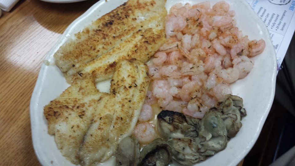 Restaurant menu with seafood, steak, and chicken dishes.